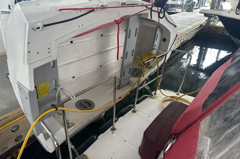 Slide: The Image of 2018 Ranger Tugs R-31 S boat stern with dockside view and mooring lines. - 8