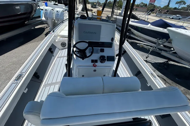 Slide: The Image of 2022 Pathfinder 2600 TRS boat interior with Garmin navigation system and dual engines. - 10