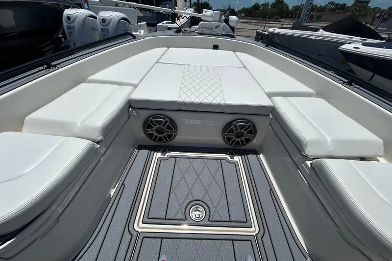 Slide: The Image of 2022 Pathfinder 2600 TRS boat interior with cushioned seating and sleek design. - 11