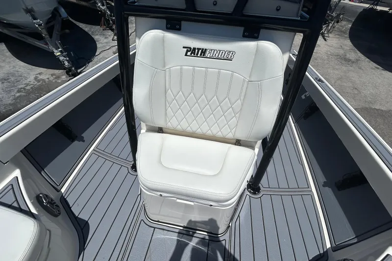 Slide: The Image of White seat on 2022 Pathfinder 2600 TRS boat, featuring diamond stitching and sleek design. - 14