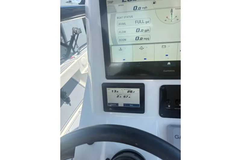 Slide: The Image of 2022 Pathfinder 2600 TRS boat dashboard with Garmin display and fuel status. - 18