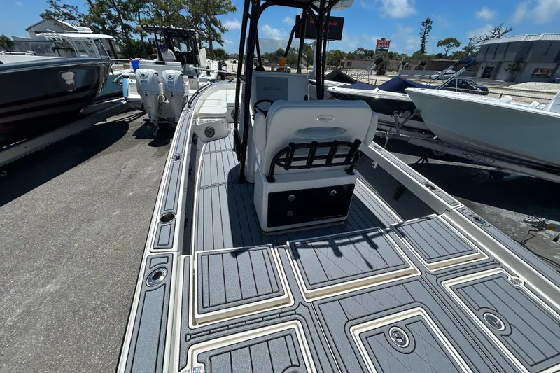 Slide: The Image of 2022 Pathfinder 2600 TRS boat with sleek deck design and modern seating. - 9