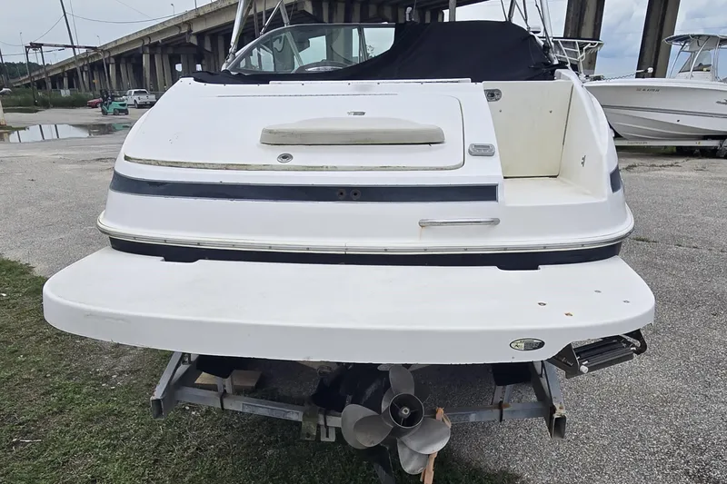 Slide: The Image of 2008 Maxum 2400 SR3 boat on trailer, rear view showing propeller and swim platform. - 2