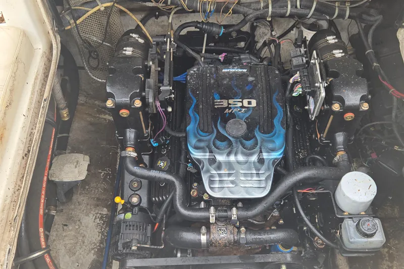 Slide: The Image of Engine of a 2008 Maxum 2400 SR3 boat, featuring a 350 MPI motor. - 4
