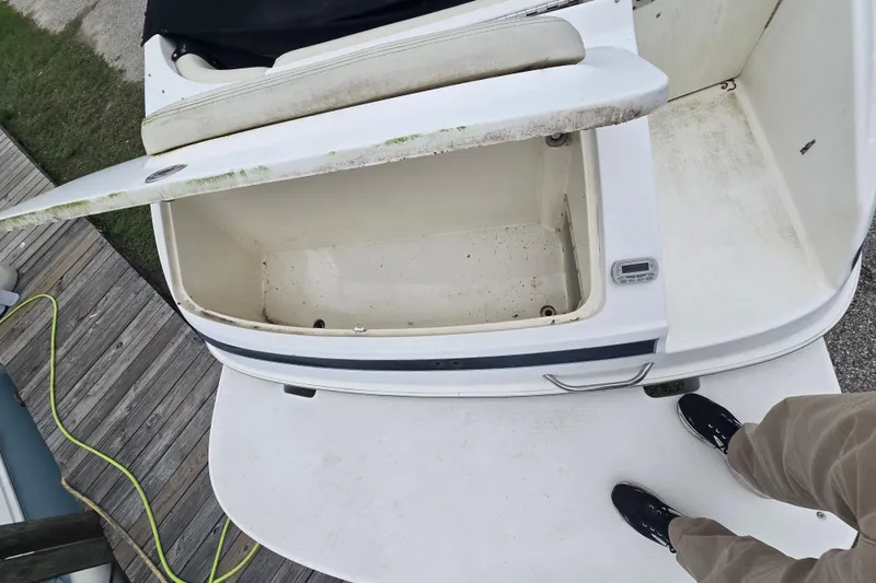 Slide: The Image of Open storage compartment on a 2008 Maxum 2400 SR3 boat, viewed from above. - 7