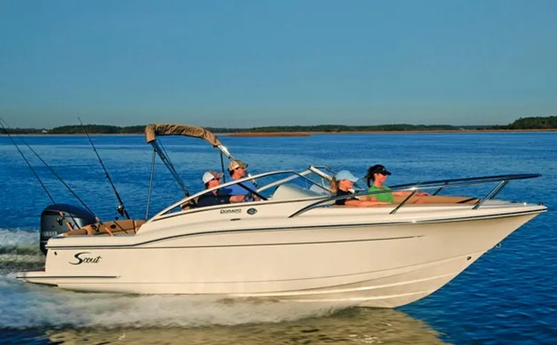 Slide: The Image of Manufacturer Provided Image: 2019 Scout 225 Dorado boat cruising on a lake with passengers. - 10