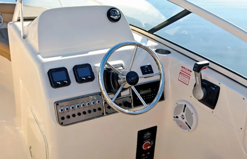 Slide: The Image of Manufacturer Provided Image: 2019 Scout 225 Dorado boat dashboard with steering wheel and control panel. - 13