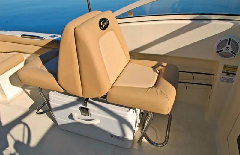 Slide: The Image of Manufacturer Provided Image: 2019 Scout 225 Dorado boat interior with tan seating and cooler. - 14