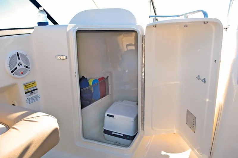 Slide: The Image of Manufacturer Provided Image: 2019 Scout 225 Dorado boat storage compartment with portable toilet and accessories. - 17