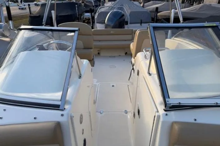 Slide: The Image of 2019 Scout 225 Dorado boat interior with dual consoles and seating. - 4