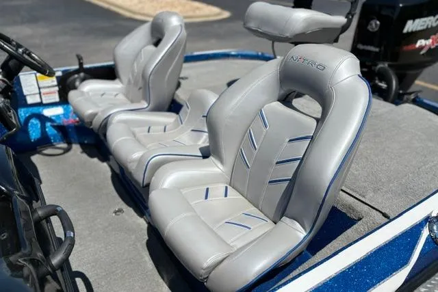 Slide: The Image of 2018 Nitro Z18 boat with sleek gray seats and blue accents. - 10