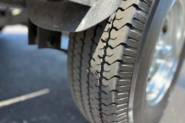 Slide: The Image of Close-up of a 2018 Nitro Z18 tire on asphalt pavement. - 17
