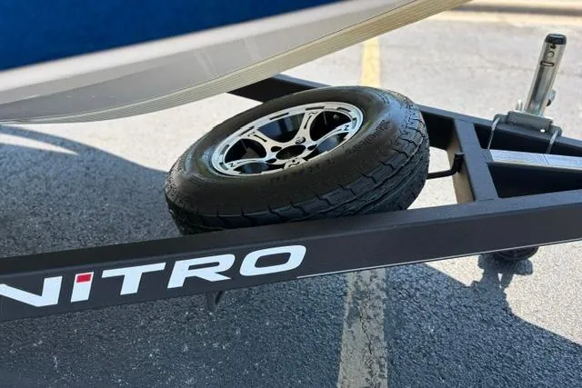 Slide: The Image of 2018 Nitro Z18 boat trailer with spare tire on asphalt. - 29