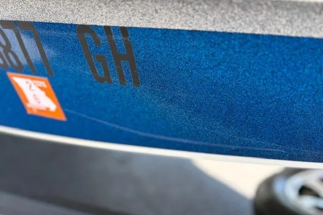 Slide: The Image of Close-up of a blue Nitro Z18 boat hull with registration numbers, 2018 model. - 30