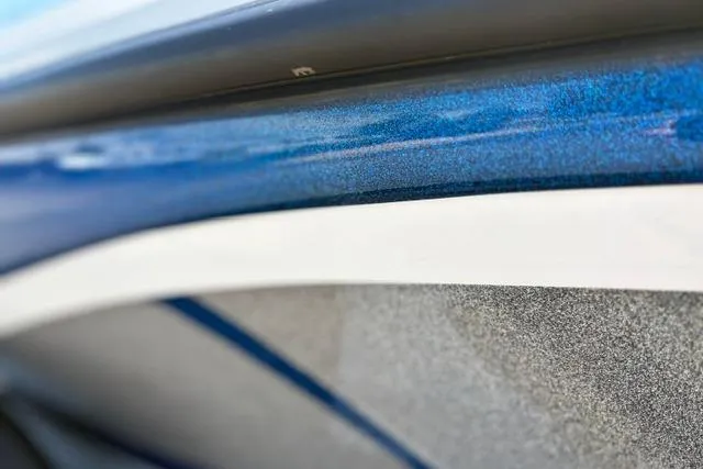 Slide: The Image of Close-up of a 2018 Nitro Z18 boat's blue and white exterior detailing. - 31