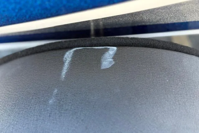Slide: The Image of Close-up of a 2018 Nitro Z18 boat surface with visible scuff marks. - 32