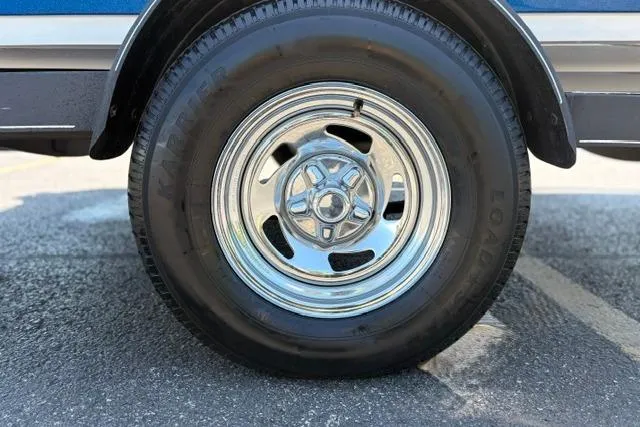 Slide: The Image of Chrome wheel of a 2018 Nitro Z18 on asphalt pavement. - 33