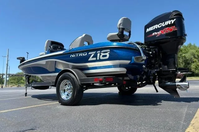 Slide: The Image of 2018 Nitro Z18 boat with Mercury Pro XS engine in a parking lot. - 41