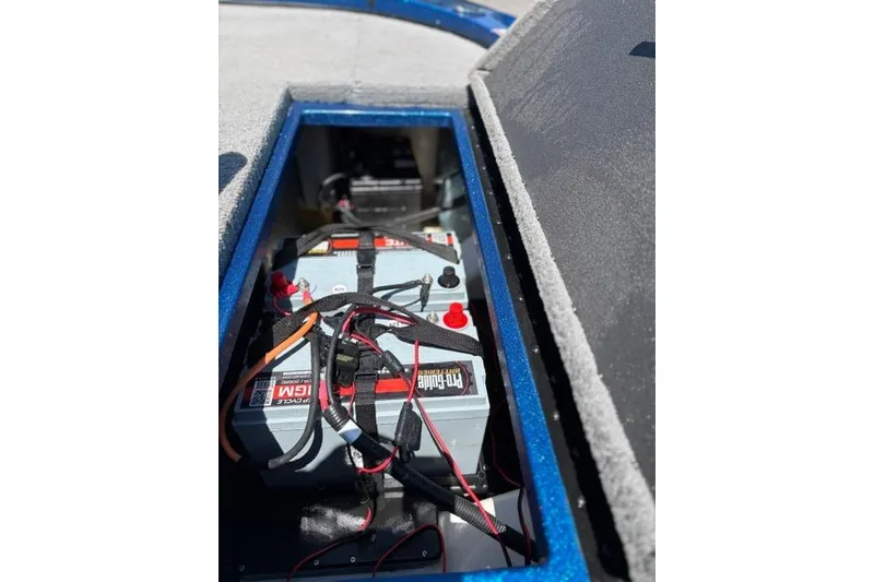 Slide: The Image of Battery compartment of a 2018 Nitro Z18 boat, featuring wiring and secure installation. - 42