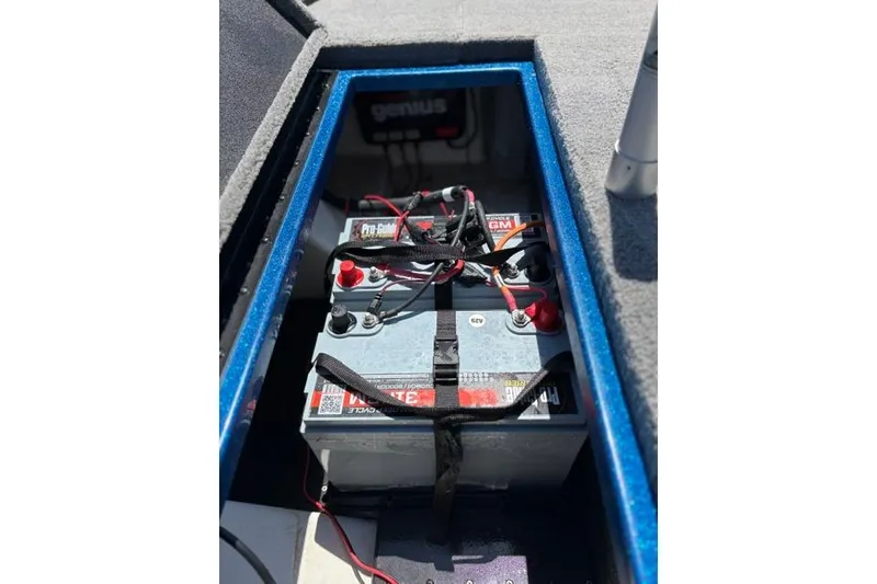 Slide: The Image of Battery compartment of a 2018 Nitro Z18 boat with wiring and charger. - 43