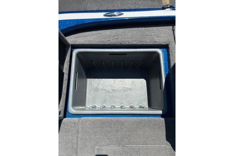 Slide: The Image of Storage compartment of a 2018 Nitro Z18 boat, featuring a gray interior. - 46