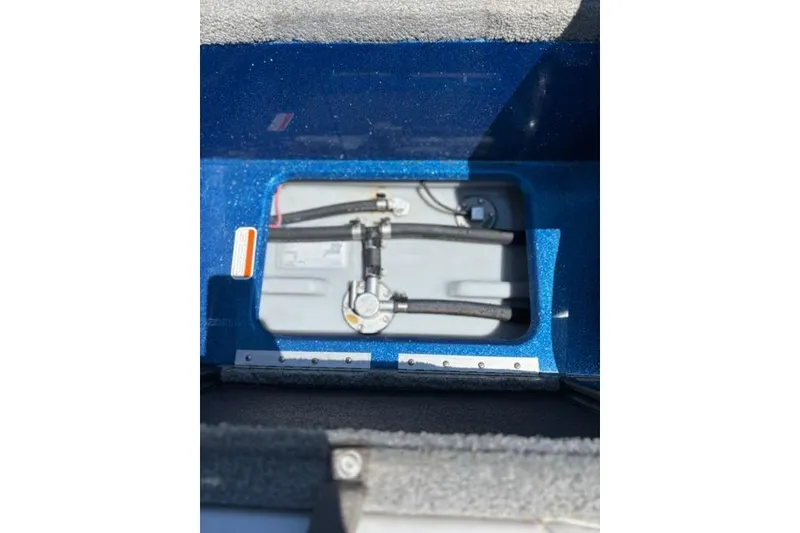 Slide: The Image of 2018 Nitro Z18 boat fuel tank compartment with hoses and fittings. - 47