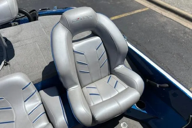 Slide: The Image of Gray leather seat in a 2018 Nitro Z18 boat, featuring blue accents. - 49