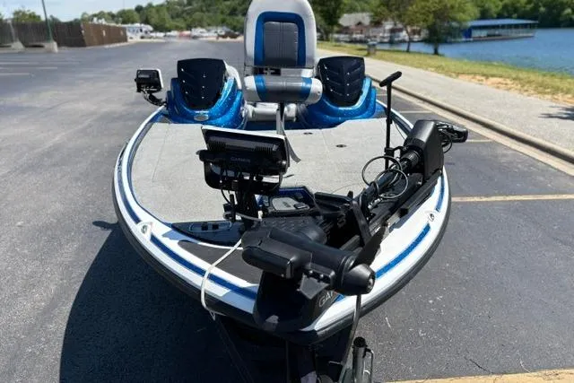 Slide: The Image of 2018 Nitro Z18 fishing boat with advanced navigation equipment, parked near a lakeside. - 5