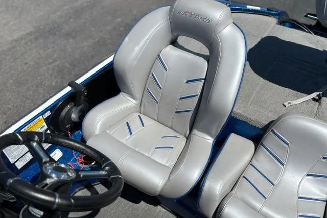 Slide: The Image of Driver's seat of a 2018 Nitro Z18 boat with steering wheel. - 50