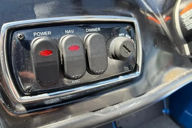 Slide: The Image of Control panel of a 2018 Nitro Z18 boat with power, navigation, and dimmer switches. - 51