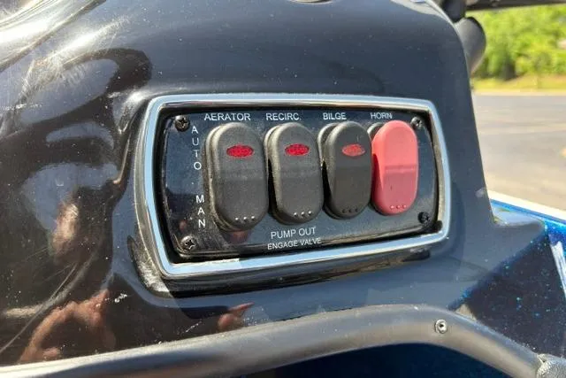 Slide: The Image of Control panel of a 2018 Nitro Z18 boat with switches for aerator, recirc, bilge, and horn. - 52