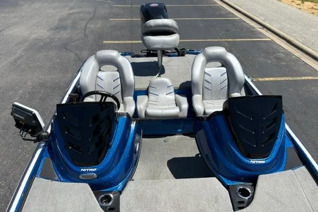 Slide: The Image of 2018 Nitro Z18 boat with dual consoles and seating, parked on pavement. - 62