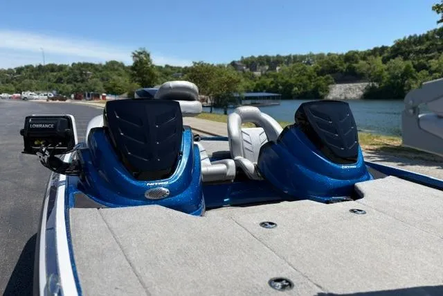 Slide: The Image of 2018 Nitro Z18 boat with dual seats and Lowrance fish finder by a lake. - 66
