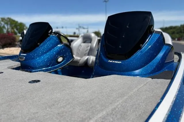 Slide: The Image of 2018 Nitro Z18 boat with blue metallic finish and sleek design. - 9