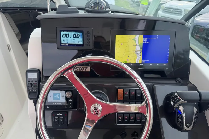 Slide: The Image of Dashboard of 2022 Pursuit DC 266 Dual Console with navigation and control systems. - 15