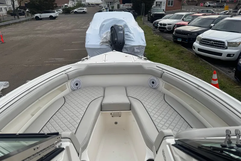 Slide: The Image of 2022 Pursuit DC 266 Dual Console boat with spacious seating and modern design. - 17