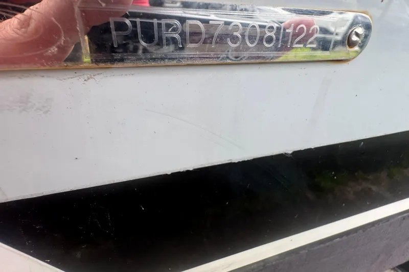 Slide: The Image of 2022 Pursuit DC 266 Dual Console boat hull identification number. - 26