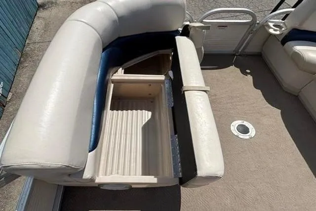 Slide: The Image of 2008 Sun Tracker Party Barge 18 DLX with open storage compartment on deck. - 11