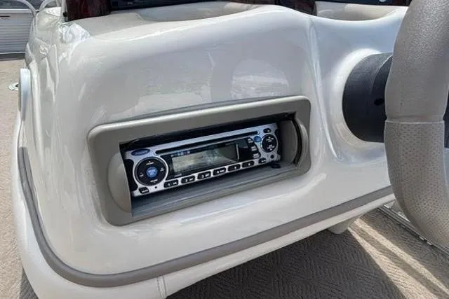 Slide: The Image of 2008 Sun Tracker Party Barge 18 DLX dashboard with built-in stereo system. - 16
