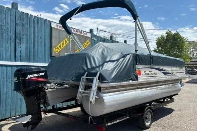 Slide: The Image of 2008 Sun Tracker Party Barge 18 DLX pontoon boat with Mercury outboard motor on trailer. - 23