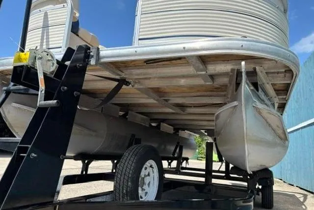 Slide: The Image of 2008 Sun Tracker Party Barge 18 DLX pontoon boat on trailer, viewed from below. - 3