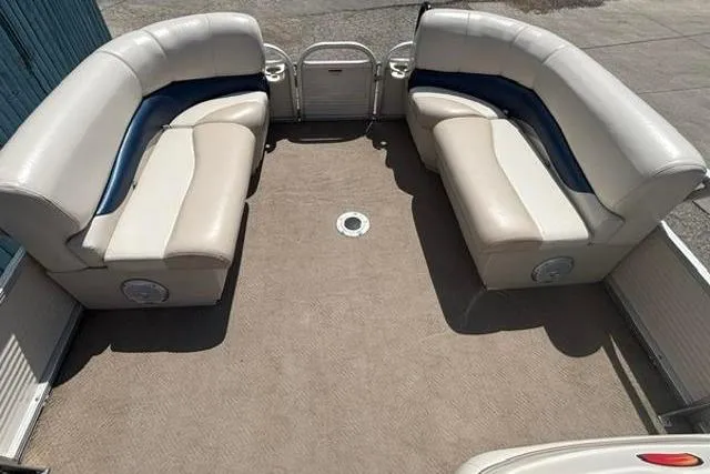 Slide: The Image of 2008 Sun Tracker Party Barge 18 DLX interior with spacious seating and carpeted deck. - 7
