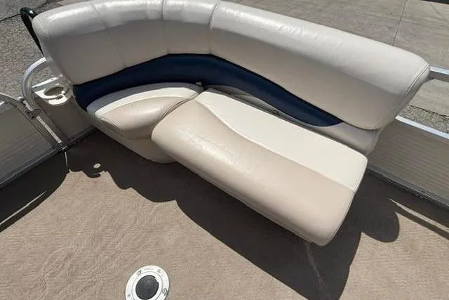 Slide: The Image of 2008 Sun Tracker Party Barge 18 DLX pontoon boat seating, beige and blue upholstery. - 8