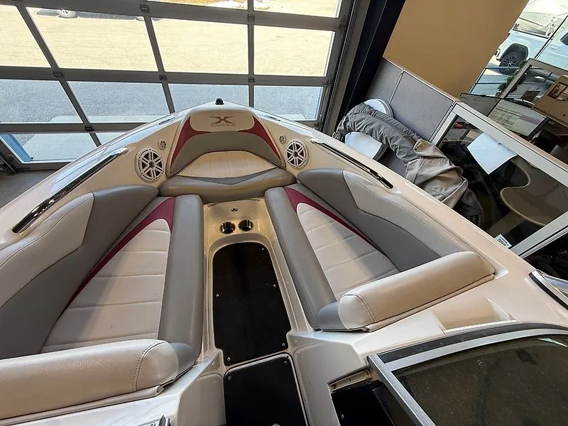 Slide: The Image of Interior of a 2008 MasterCraft X-15 boat with gray and red seating. - 12