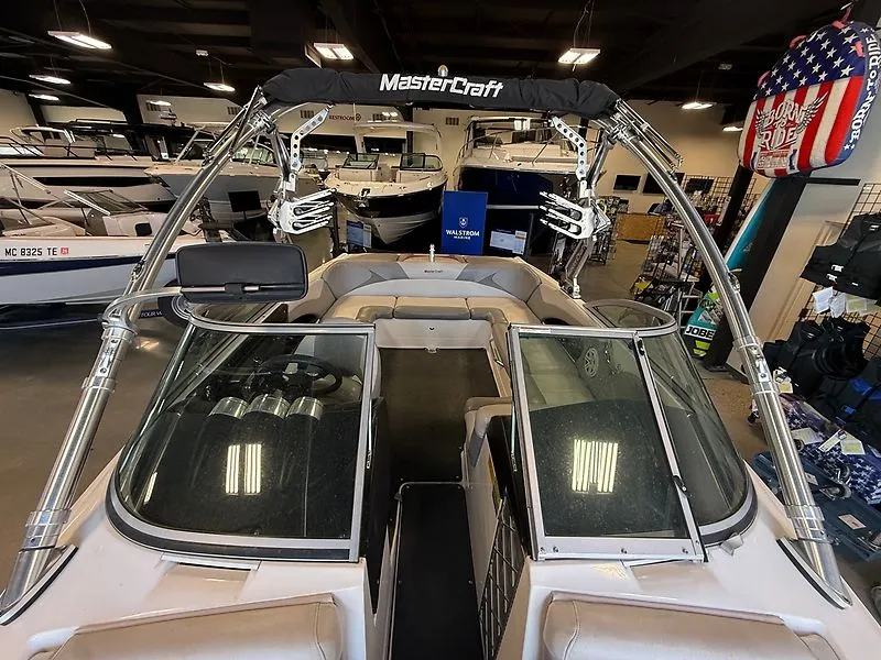 Slide: The Image of Interior view of a 2008 MasterCraft X-15 boat in showroom. - 13