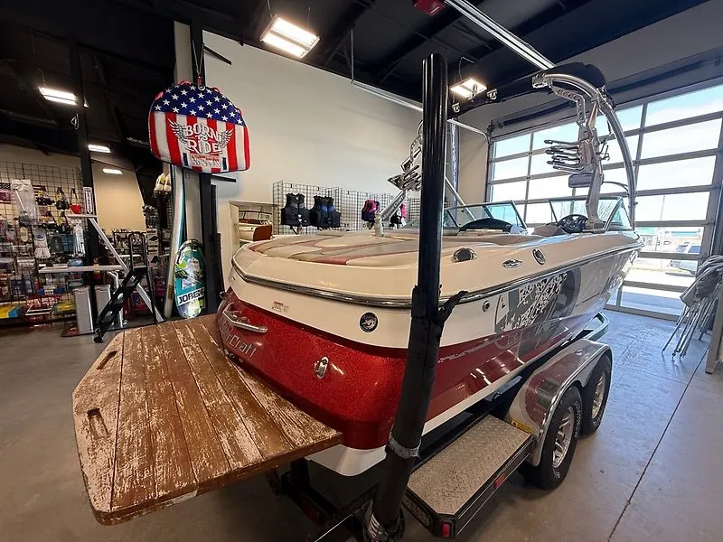 Slide: The Image of 2008 MasterCraft X-15 boat displayed in a workshop. - 16