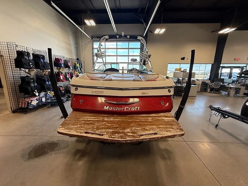 Slide: The Image of 2008 MasterCraft X-15 boat in a workshop with accessories in the background. - 5