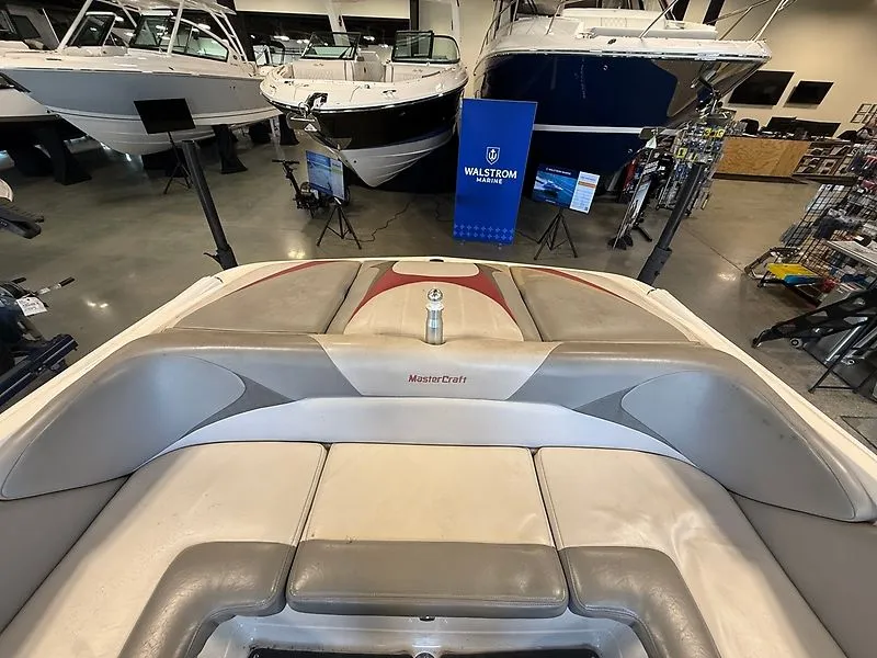 Slide: The Image of 2008 MasterCraft X-15 boat in showroom with other boats. - 7