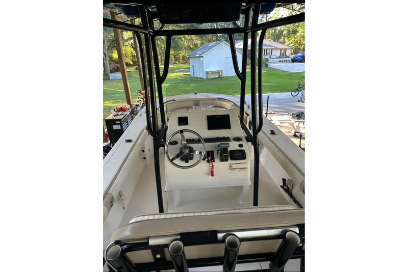 Slide: The Image of 2017 Carolina Skiff 24 Ultra Elite boat interior with steering console and controls. - 3
