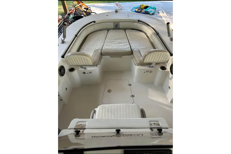 Slide: The Image of 2017 Carolina Skiff 24 Ultra Elite boat interior with cushioned seating and storage. - 4